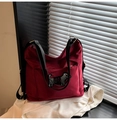 Detail shot of a deep red nylon tote bag with a sparkling rhinestone puppy motif - Red