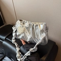 Silver metallic pleated shoulder bag featuring a lace bow and pearl heart charm detail - Silver