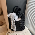 Handmade black crochet hollow shoulder bag featuring a large white lace bow and drawstring liner - Black