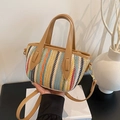 Sac seau en paille tissée colorée avec poignée en cuir marron et détails dorés - Kaki