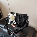 Chic black pleated shoulder bag with lace bow and pearl charms in glossy leather - Black