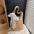 Bohemian hand-woven straw bucket bag in light camel with white lace ribbon detail - Khaki