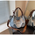 Detail of blue vintage hobo bag with brown leather handle and wide shoulder strap - Blue