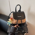 Straw weave mini backpack in beige with black leather trim and doll pendant accessory - Black with Pendant