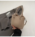 Beige litchi grain leather handbag featuring creative knot handle and crossbody strap - Apricot (Without Charm)