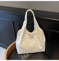 Minimalist beige polka dot canvas tote bag with black dots and top handle on a wooden chair - White