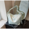 Detail of mint green canvas tote featuring pleated shoulder strap and white embroidery - Mint Green