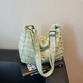Light green denim tote bag with frayed fringe texture and adjustable black strap - Style 2 Green