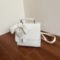Chic white bow shoulder bag with pearl heart pendant and unique wrinkled leather texture - White