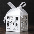 Detailed laser-cut white Christmas favor box with snowman motif and large white ribbon bow - White