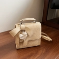 Beige textured leather bow shoulder bag with pearl heart charm and top handle - Yellow