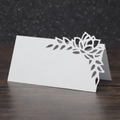 Close-up of white laser-cut floral place card with crystal accents on dark background - 10*10CM / White