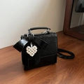 Chic black patent leather bow bag with pearl heart pendant and wrinkled texture - Black