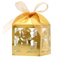 Macro detail of golden snowman hollow-out candy box with stars and a sheer ribbon bow - Reflective Gold