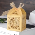 Elegant gold laser-cut wedding favor box with intricate floral patterns and silk ribbon - 5*5*8CM / Gold