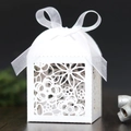 Elegant white laser-cut wedding favor box with floral patterns and a satin ribbon bow - 5*5*8CM / White