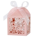 Macro view of laser-cut floral patterns on pink pearlescent wedding favor box with ribbon - 5*5*8CM / Pink