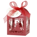 Detail of red laser-cut wedding favor box with silhouettes and organza ribbon bow - 5*5*8CM / Pearlescent Red
