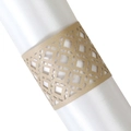 Close-up of golden laser-cut hollow napkin ring featuring a geometric diamond pattern - Beige Gold