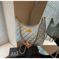 Quilted light blue underarm bag with gold chain strap and metallic twist lock - Blue