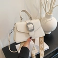 Chic beige lychee pattern handbag with silver metal buckle and ethnic embroidery strap - Off White