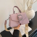 Chic light purple handbag with textured leather finish and ethnic woven strap - Purple