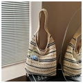 Detail of hand-woven straw tote bag with blue stripes and a tulip flower pendant decoration - White/Black Stripes with Pendant