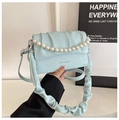 Detail of light blue pleated cloud bag featuring pearl chain and faux leather strap - Light Blue