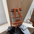 Petit sac seau tissé à rayures colorées avec garniture en cuir marron et poignées - Coloré