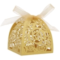 Close-up of golden laser-cut rose hollow candy box with an elegant champagne ribbon bow - Gold