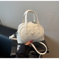 Chic cream white leather shoulder bag featuring a 3D heart relief and silver hardware - Off-white