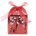 Detail of laser-cut red wedding favor box with bride and groom silhouette and red ribbon - Mirror Red