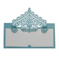 Macro detail of laser-cut lace crown design on light blue glitter wedding place card - Tiffany Blue