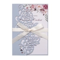 Detail of laser-cut floral light blue wedding invitation with a white satin ribbon bow - Mist Blue