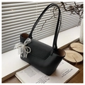 Detail of black pebble leather tote bag with elegant white lace and pearl bow charm - Black