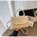Elegant off-white leather crossbody bag with lychee texture and adjustable strap - Khaki