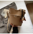 Detail of khaki litchi texture bucket bag with horse charm and silver buckle strap - Khaki With Pendant