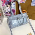 Sac ita en denim bleu clair avec fenêtre transparente, détails résille et chaînes - Bleu