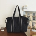 Large black tote bag with drawstring closure and white stripe handles for daily commute - Black