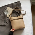 Chic beige lychee grain leather bucket bag with adjustable shoulder strap for women - Khaki