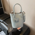 Light blue lychee leather bucket bag with top handle and elephant charm - Blue