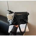 Detail of black pleated patent leather handbag with pearl heart and lace bow - Black with Pendant