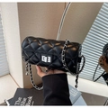 Elegant black quilted cylindrical chain bag with silver twist lock and leather strap - Black