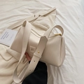 Chic beige pleated leather pillow bag with wide shoulder strap and gold hardware accents - White