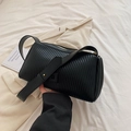 Chic black pleated shoulder bag with vertical texture and gold zipper hardware - Black