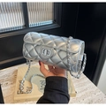 Chic silver quilted cylinder bag with metallic chain strap and twist-lock detail - Silver