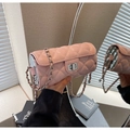 Pink quilted cylindrical crossbody bag with silver chain strap and classic metal clasp - Pink