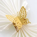 Elegant gold hollow laser-cut butterfly napkin ring on white silk fabric for weddings - Sparkling Gold