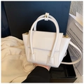 Chic off-white structured PU leather handbag with gold-tone hardware and crossbody strap - White