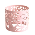 Detailed macro view of laser-cut pink pearlescent cupcake wrapper with floral pattern - Pink
